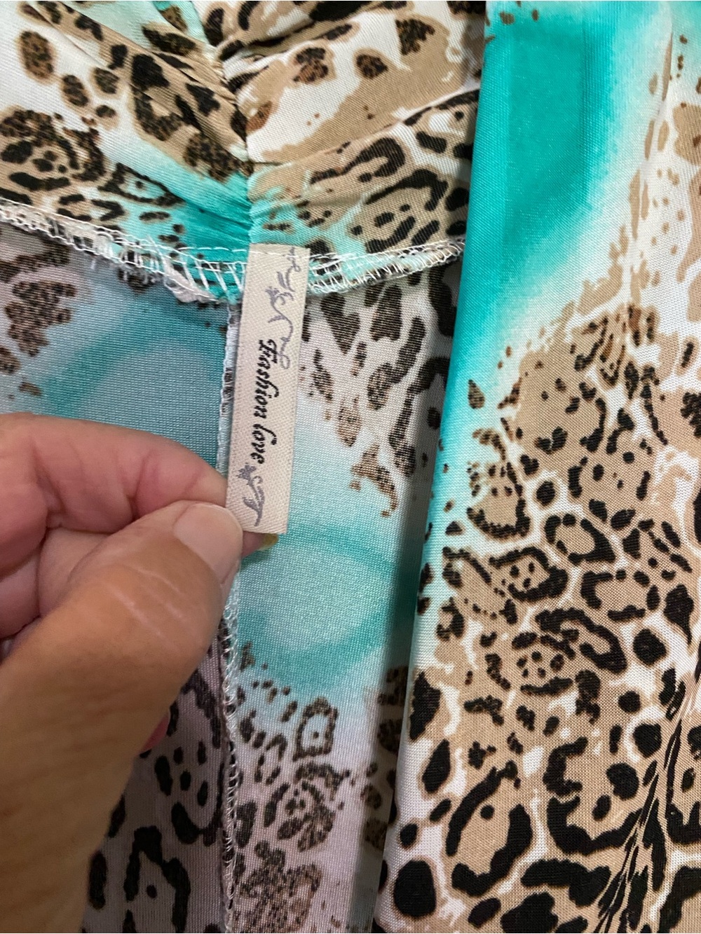 Leopard Print Jumpsuit with Turquoise Accents - Picture 3 of 5